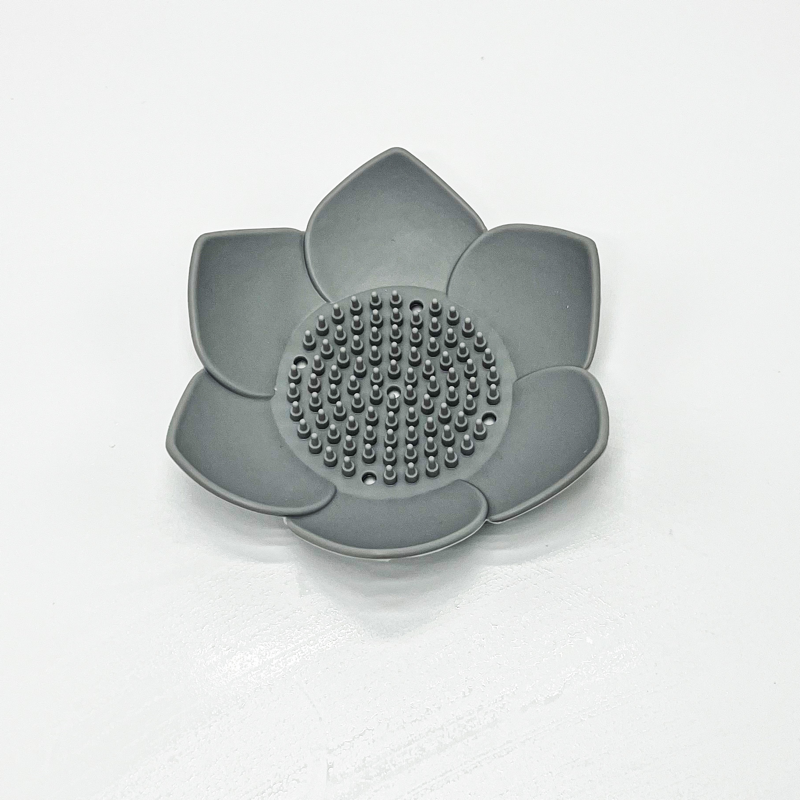 Gray lotus-shaped object on a white background